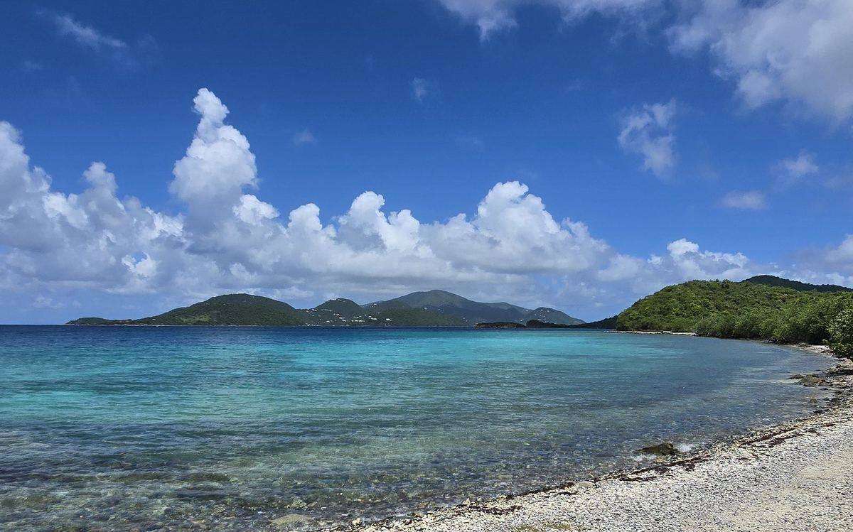 Snorkelers in clear turquoise water at Waterlemon Cay, St. John